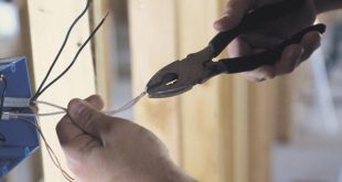 Electrician Working With Wiring